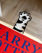 cute cat paw bookmarks reaching out of book