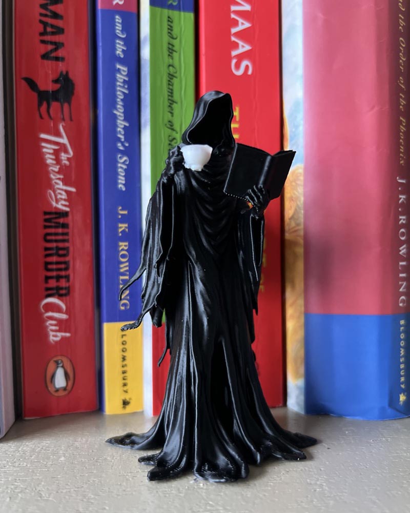 Suriel Leaning Book Figurine
