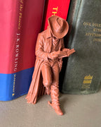 Cowboy Leaning Book Figurine