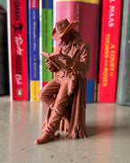 Cowboy Leaning Book Figurine