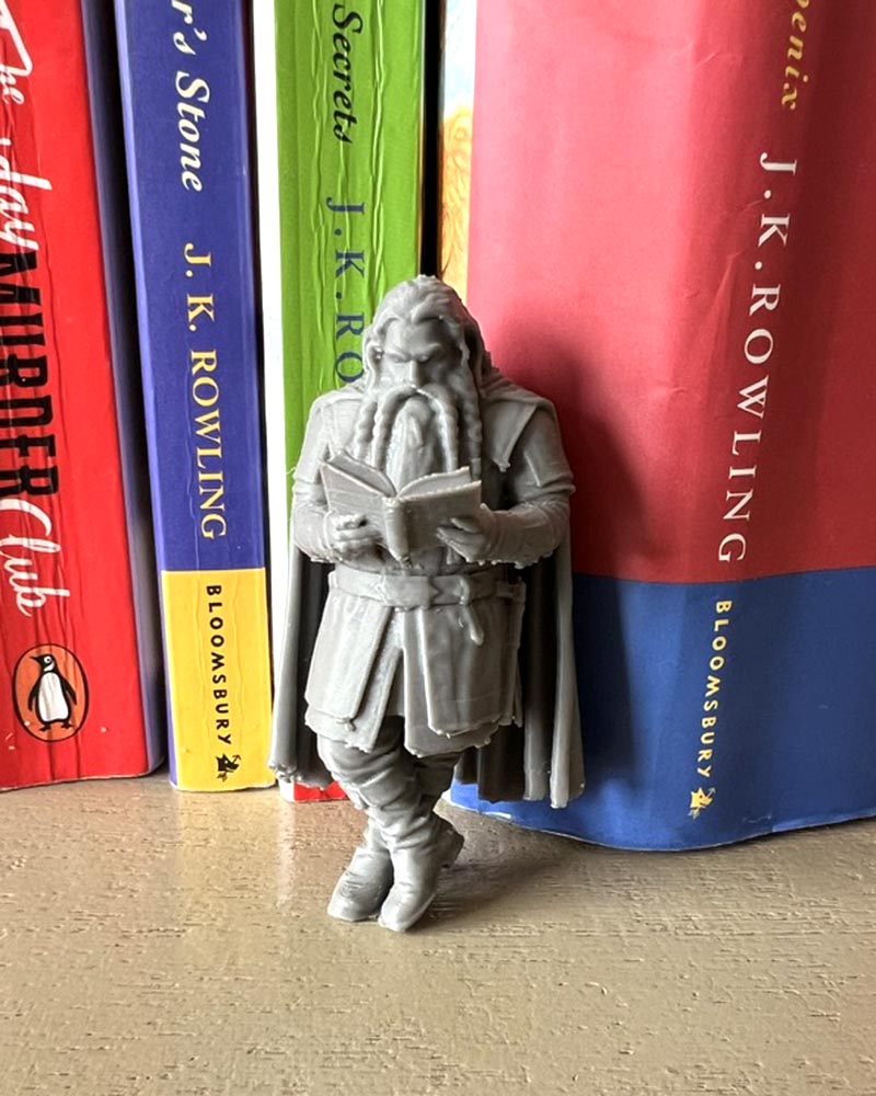 Dwarf Leaning Book Figurine