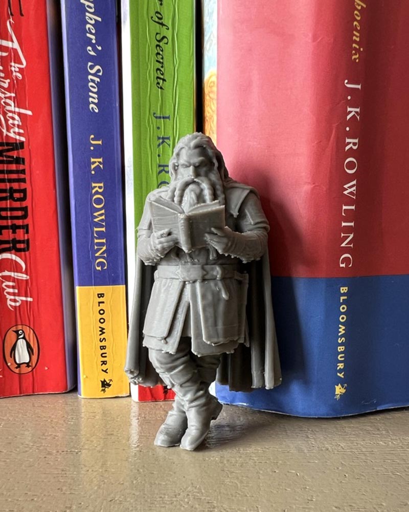 Dwarf Leaning Book Figurine