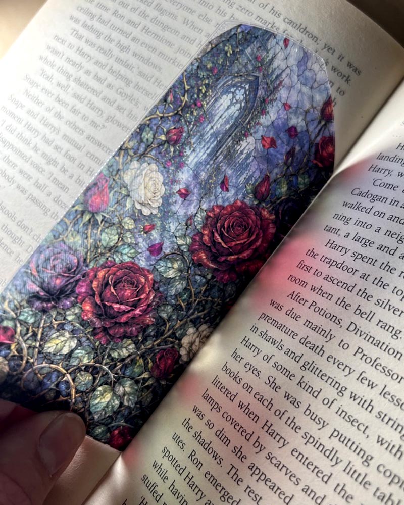 Gothic rose stained glass window bookmark featuring red and ivory roses, thorny vines and a mysterious gothic castle archway.