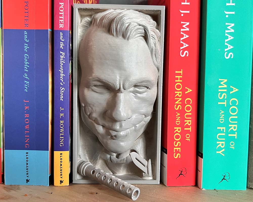 Joker book nook inspired by The Dark Knight 3D printed Joker shelf insert with sinister grin DC Comics villain bookshelf décor piece Dark Knight Joker book nook gift for collectors Gothic bookshelf insert featuring the Joker character