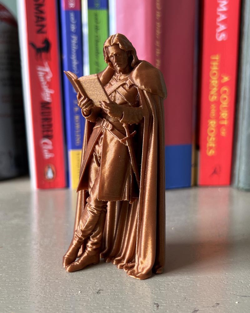 Jon Snow Leaning Book Figurine