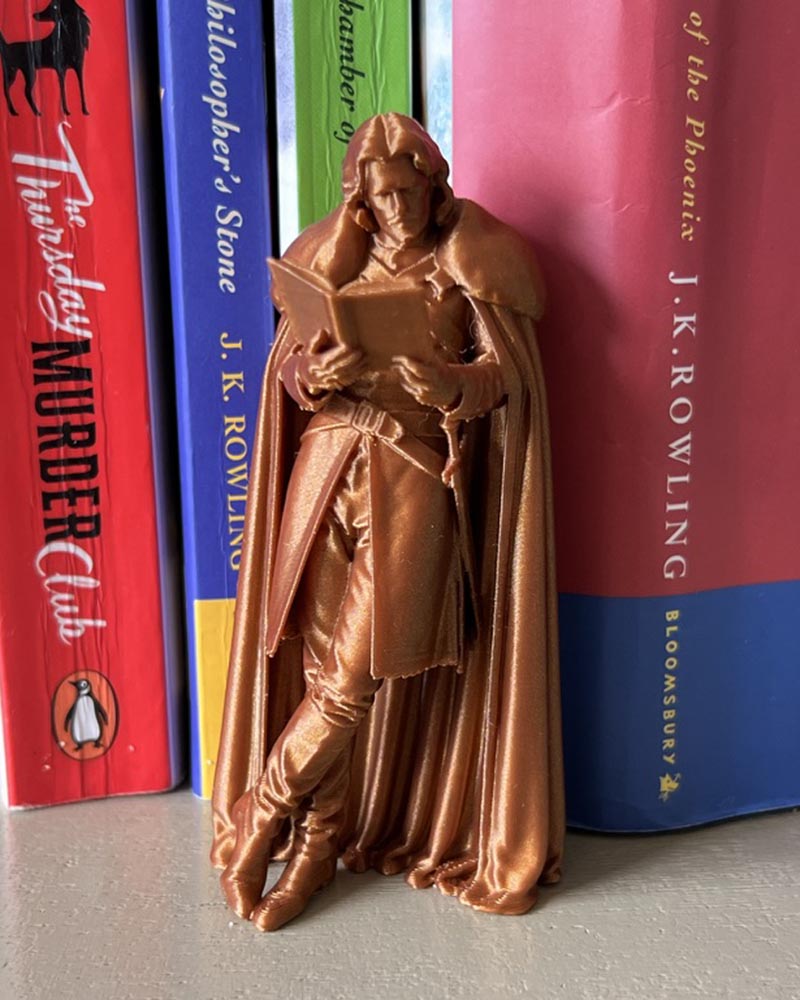 Jon Snow Leaning Book Figurine