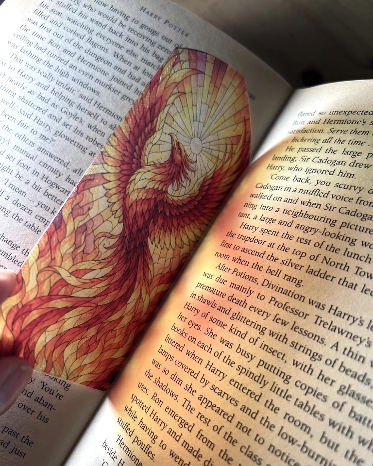 Red and gold phoenix stained glass style 3D printed bookmark featuring a fiery mythical bird rising towards the sun.