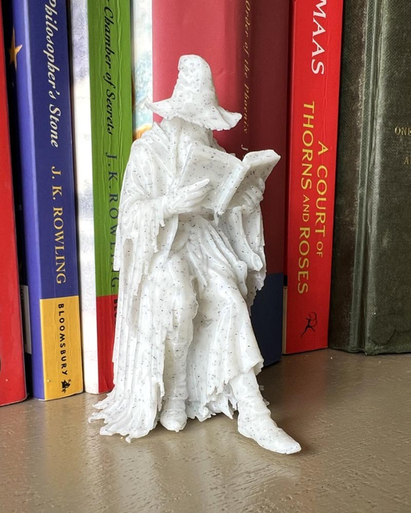 Wizzard Leaning Book Figurine