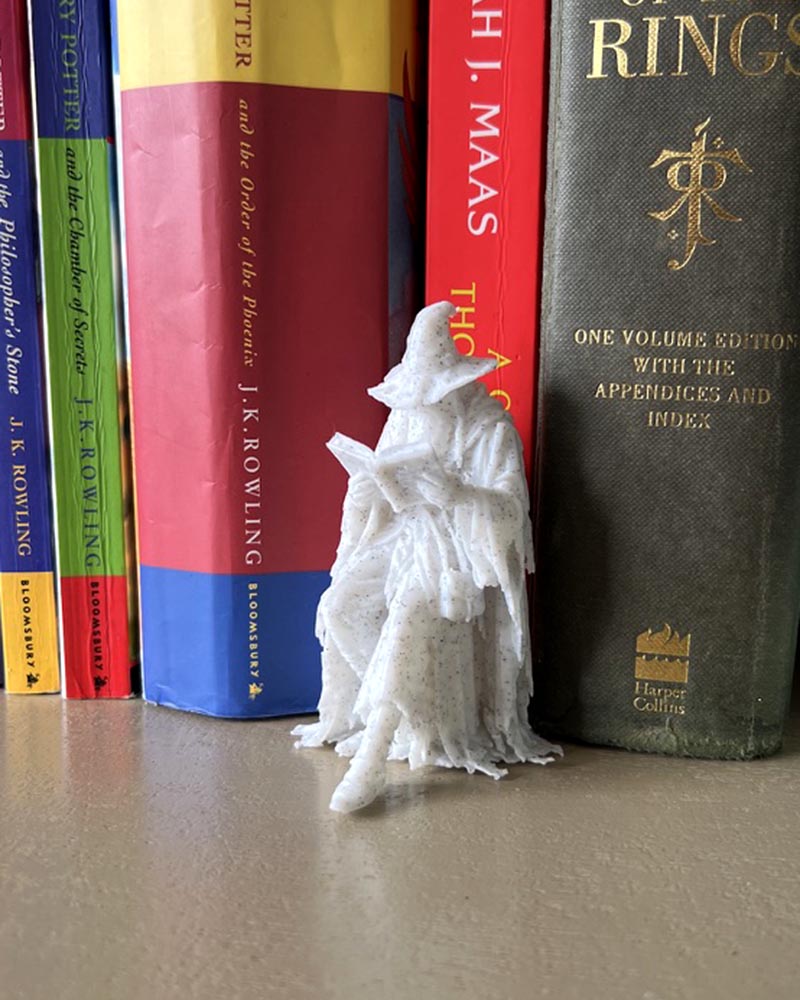 Wizzard Leaning Book Figurine