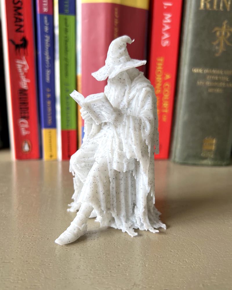 Wizzard Leaning Book Figurine